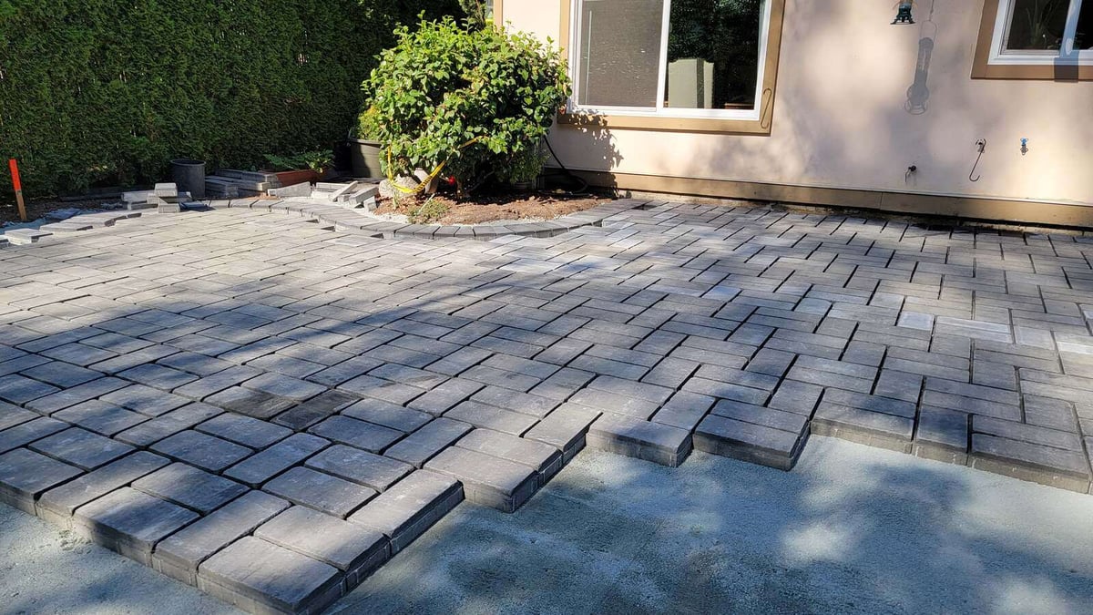 14_Interlocking pavers being installed for a custom patio design by Back40 Landscaping in Abbotsford, BC
