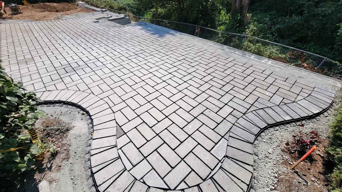 17_Paver patio with precise installation details and landscaped greenery by Back40 Landscaping in Abbotsford, BC