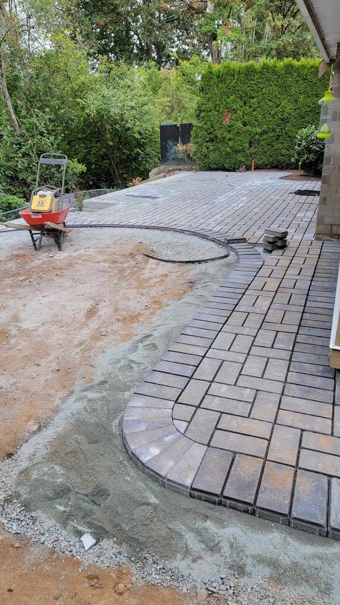 21_Partially completed paver patio with curved edges and gravel groundwork by Back40 Landscaping in Abbotsford, BC