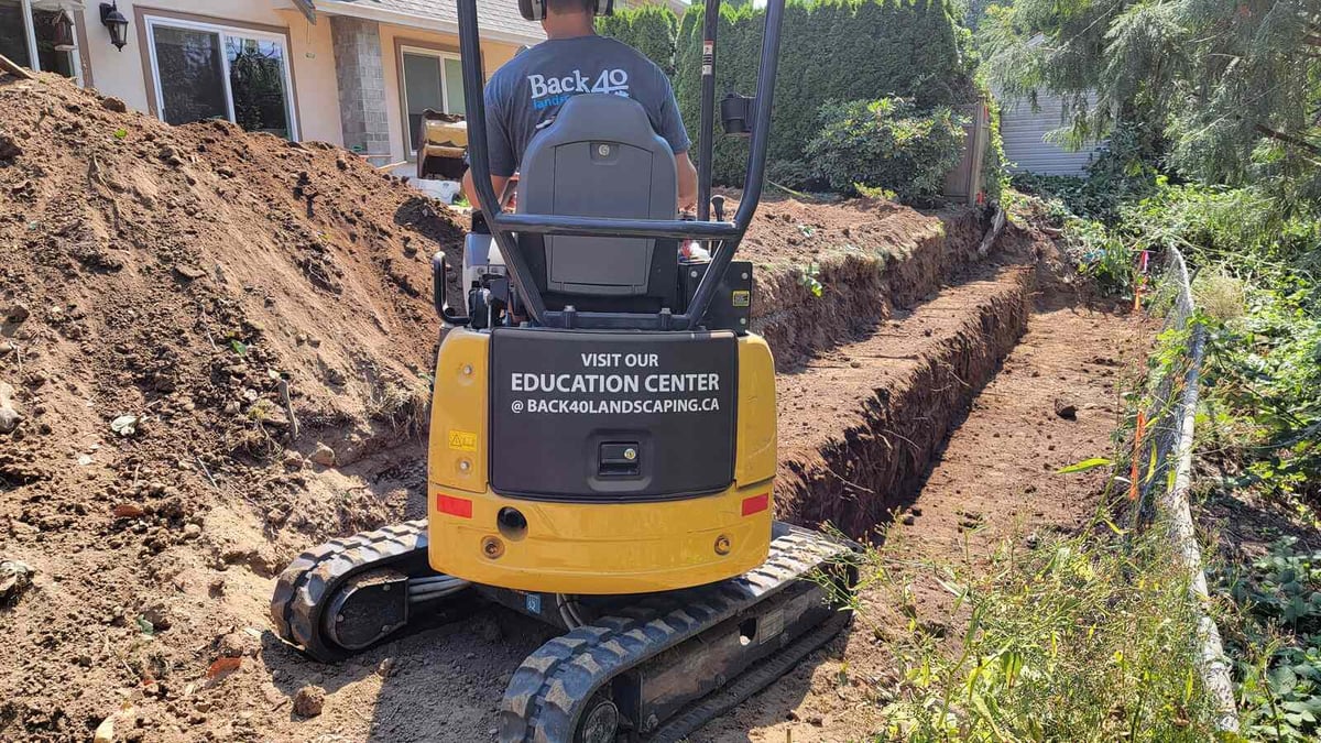 5_Backyard trench digging in Abbotsford, BC, for a landscaping project by Back40 Landscaping