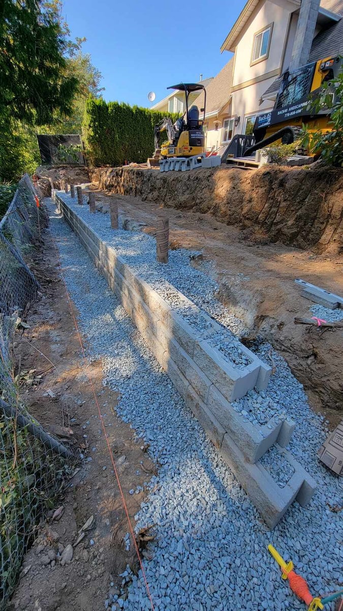 7_Gravel base and retaining wall installation in a backyard by Back40 Landscaping in Abbotsford, BC