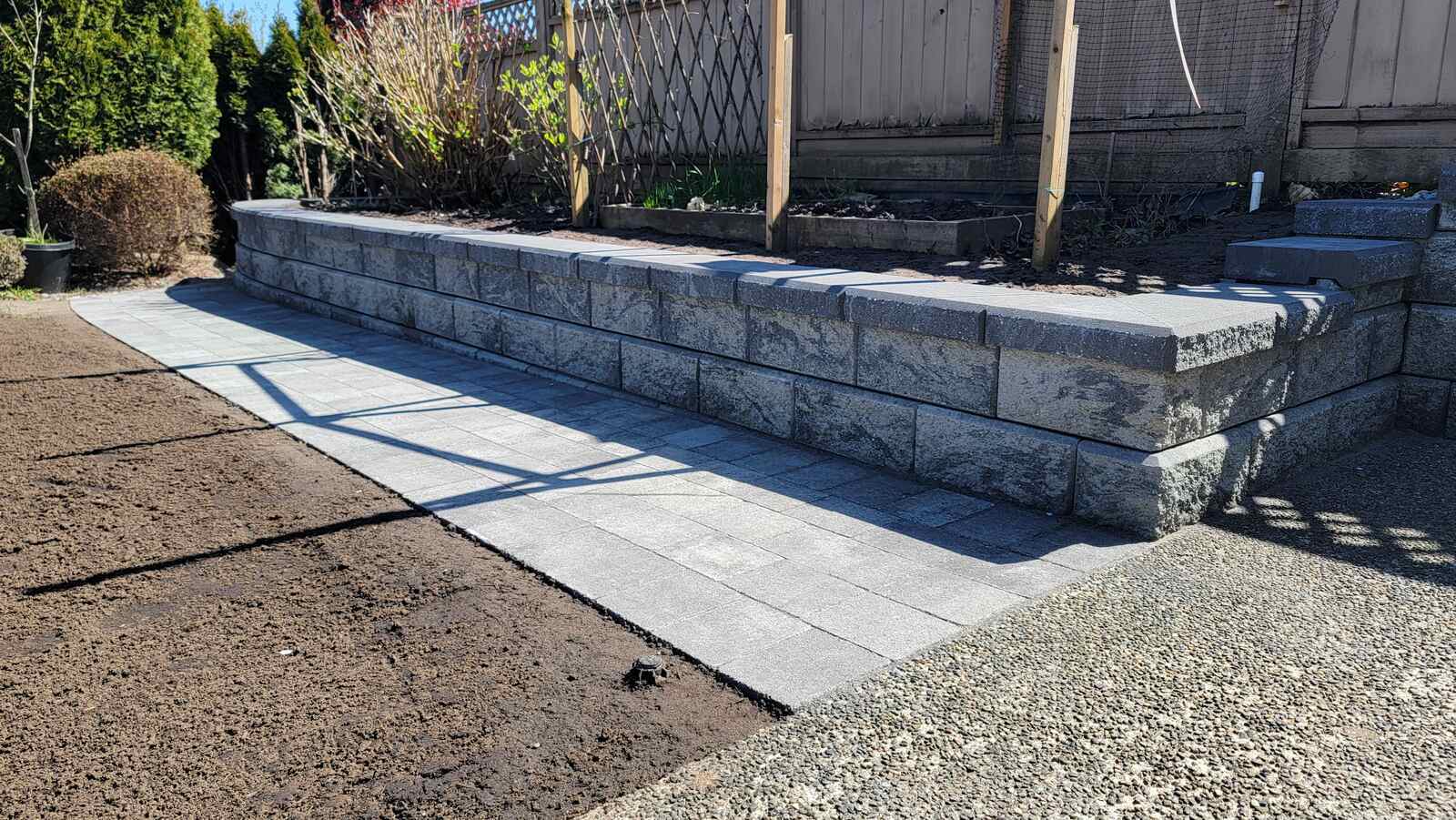 14_corner-view-of-retaining-wall-with-concrete-steps-and-garden-built-by-back40-landscaping-in-burnaby-bc