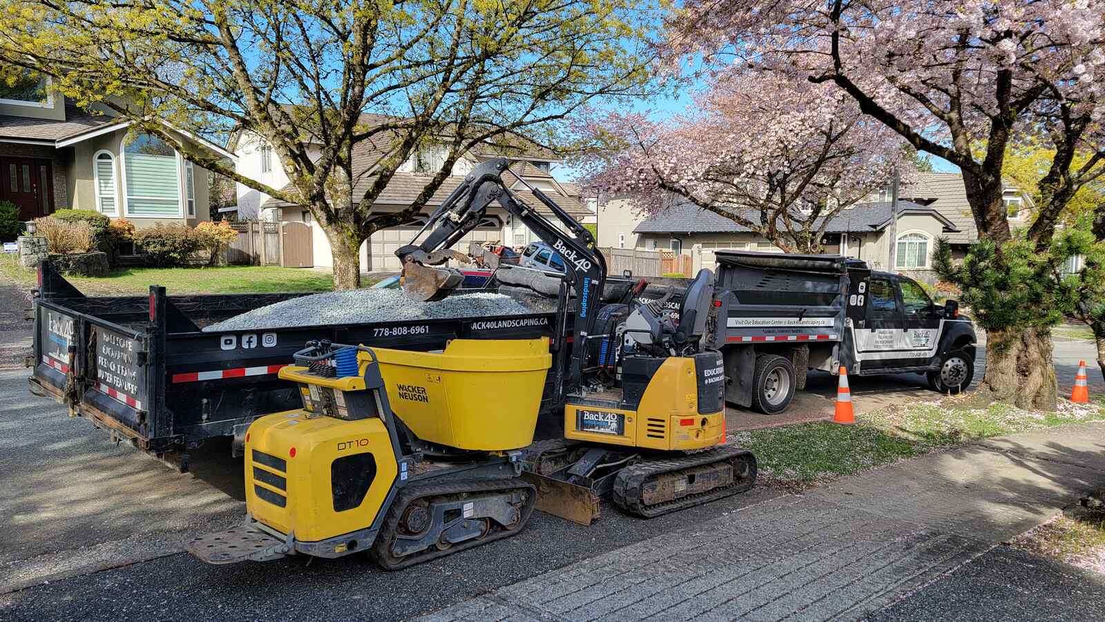 4_retaining-wall-project-back40-landscaping-burnaby-bc-equipment-and-truck-on-site-during-construction