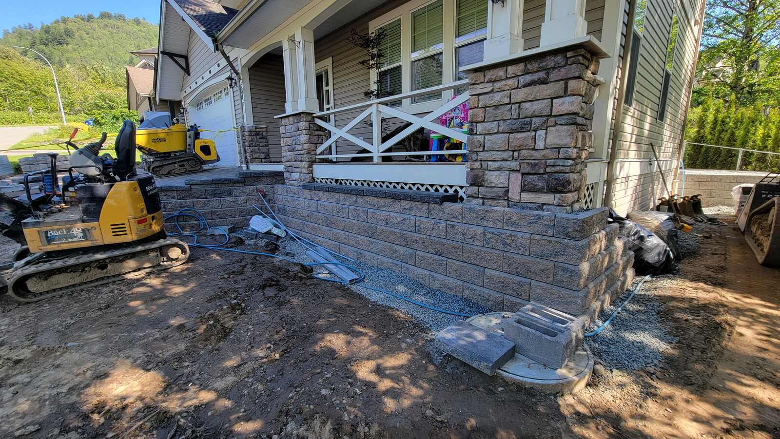 3_retaining-wall-construction-in-progress-with-heavy-machinery-by-back40-landscaping-in-chilliwack