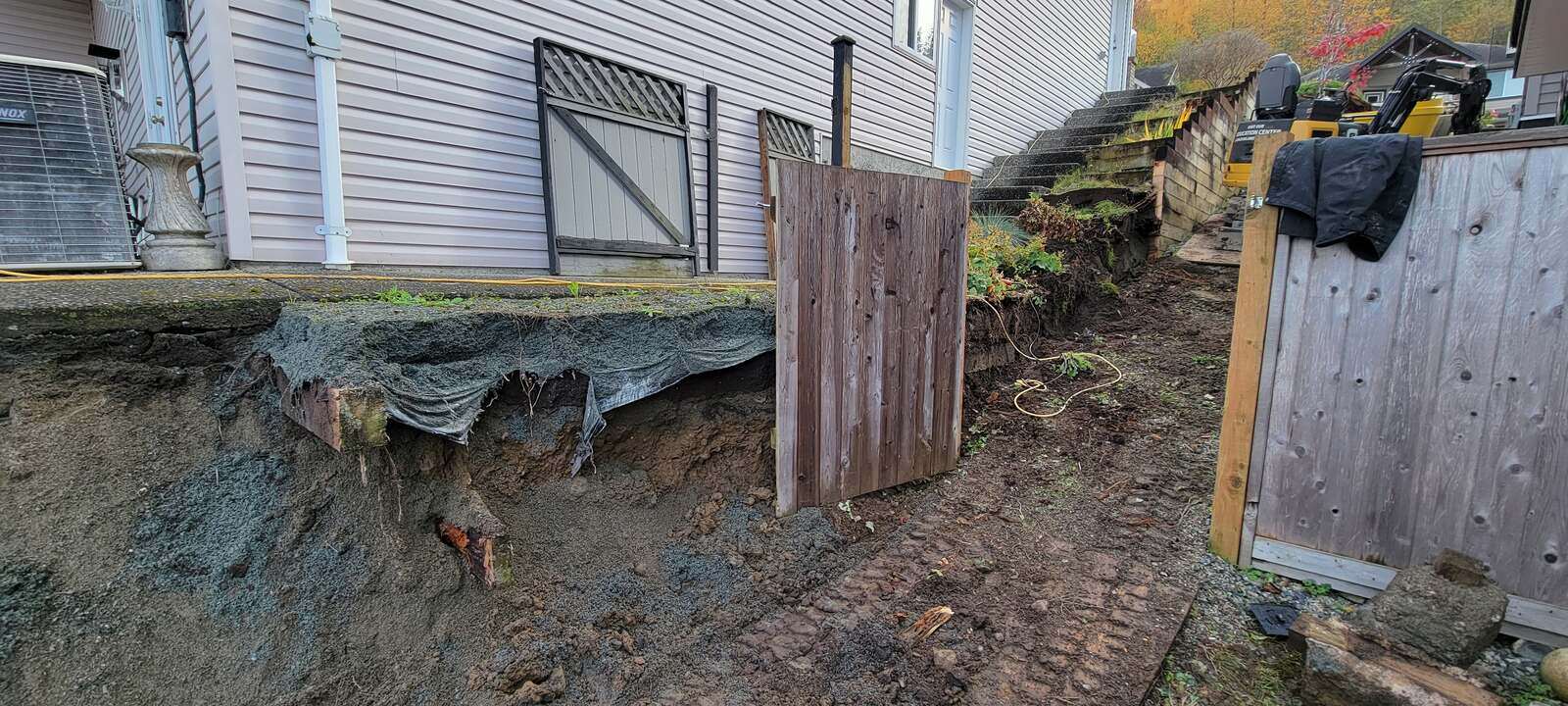 4_fully-excavated-site-with-deteriorated-retaining-wall-prepped-for-reconstruction-in-chilliwack-bc