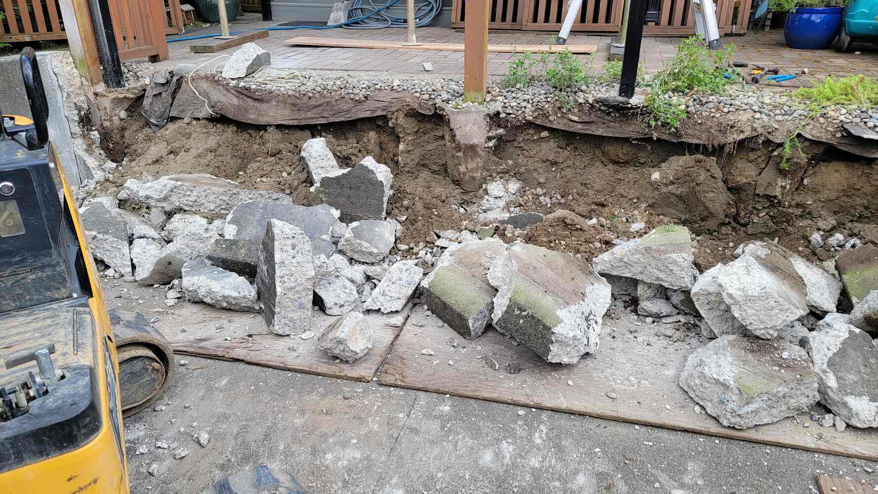 4_retaining-wall-demolition-progress-with-concrete-rubble-back40-landscaping-langley-bc