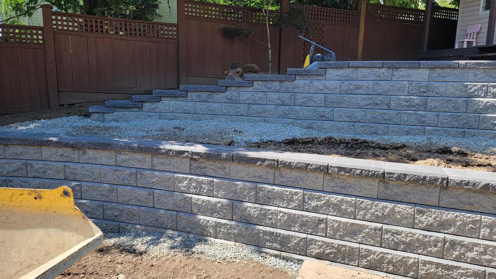 16_Multi-level retaining wall installation with tools on-site by Back40 Landscaping in Mission, BC
