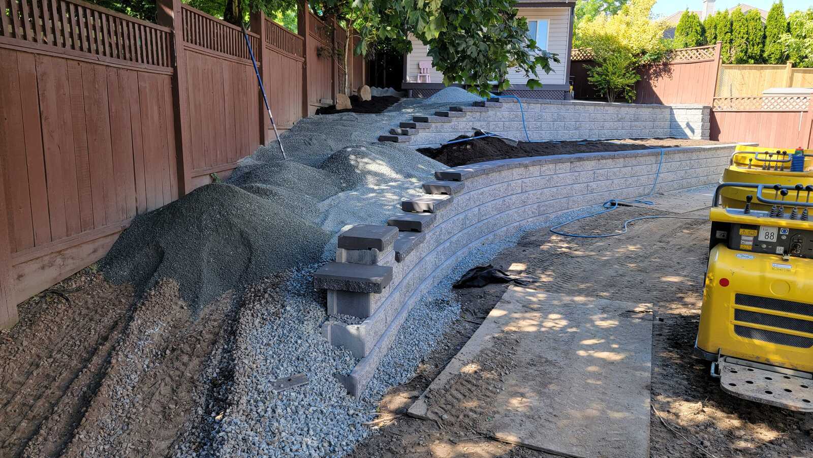 18_Final stages of landscaping with retaining wall and compacted soil by Back40 Landscaping in Mission, BC