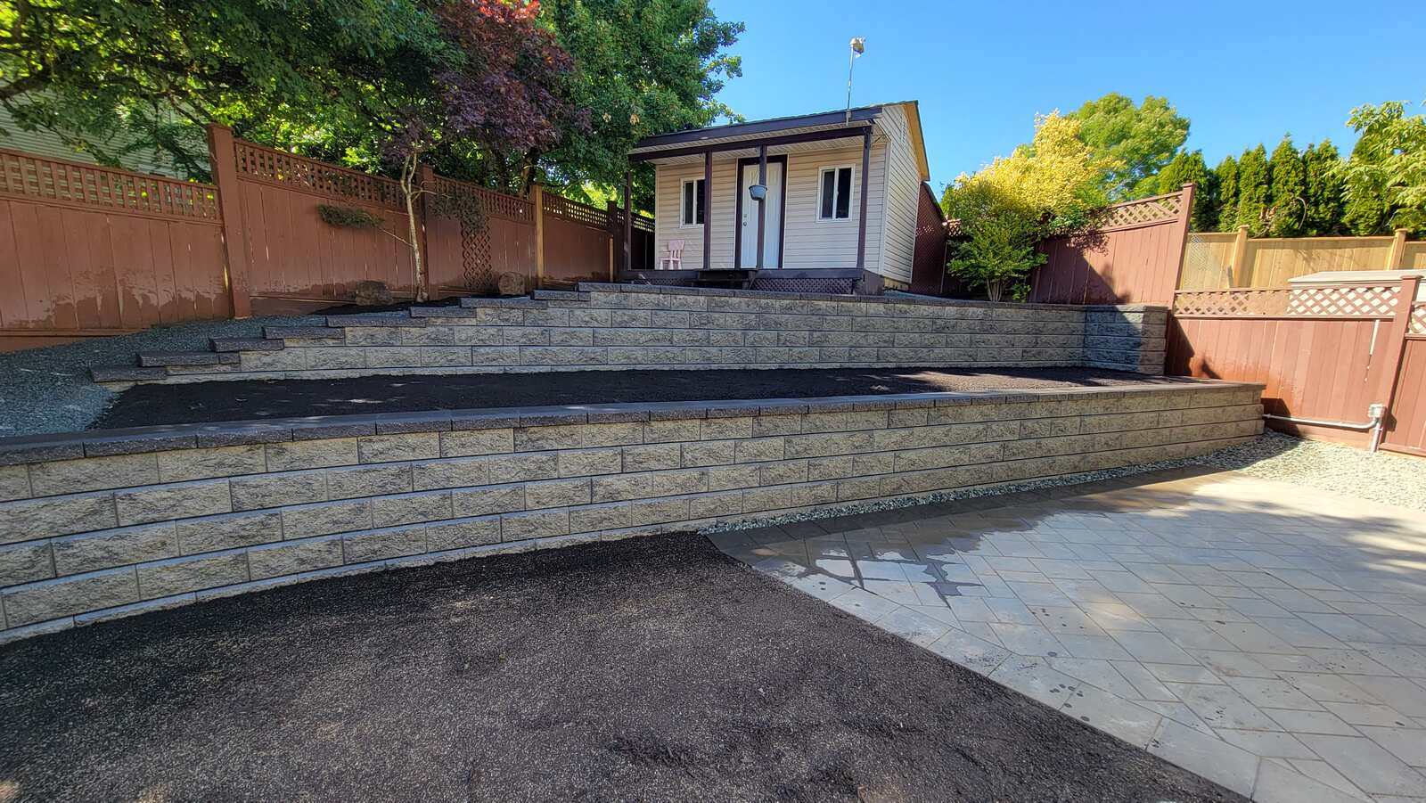 22_Finished retaining wall and landscaped backyard by Back40 Landscaping in Mission, BC