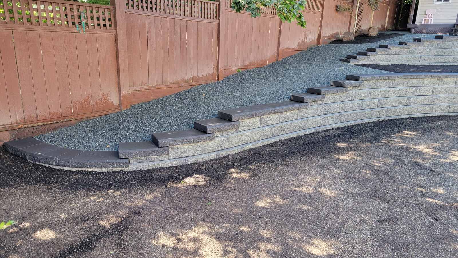 25_Side view of tiered retaining wall with steps by Back40 Landscaping in Mission, BC