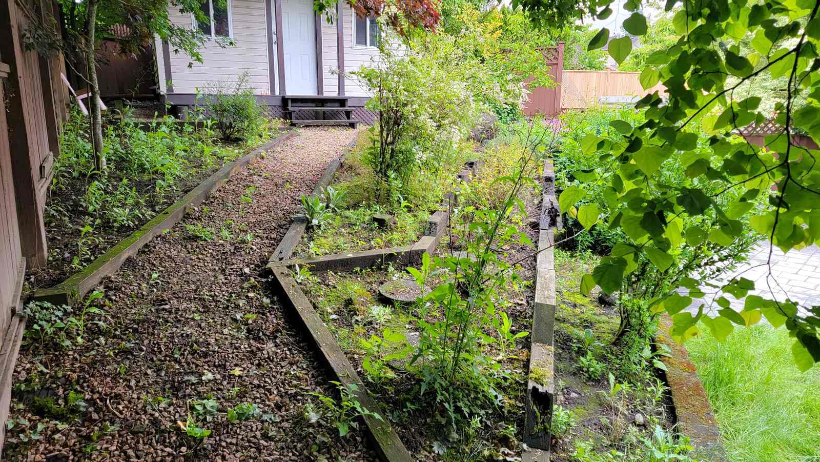 4_pathway-and-tiered-retaining-wall-with-greenery-back40-landscaping-langley-bc