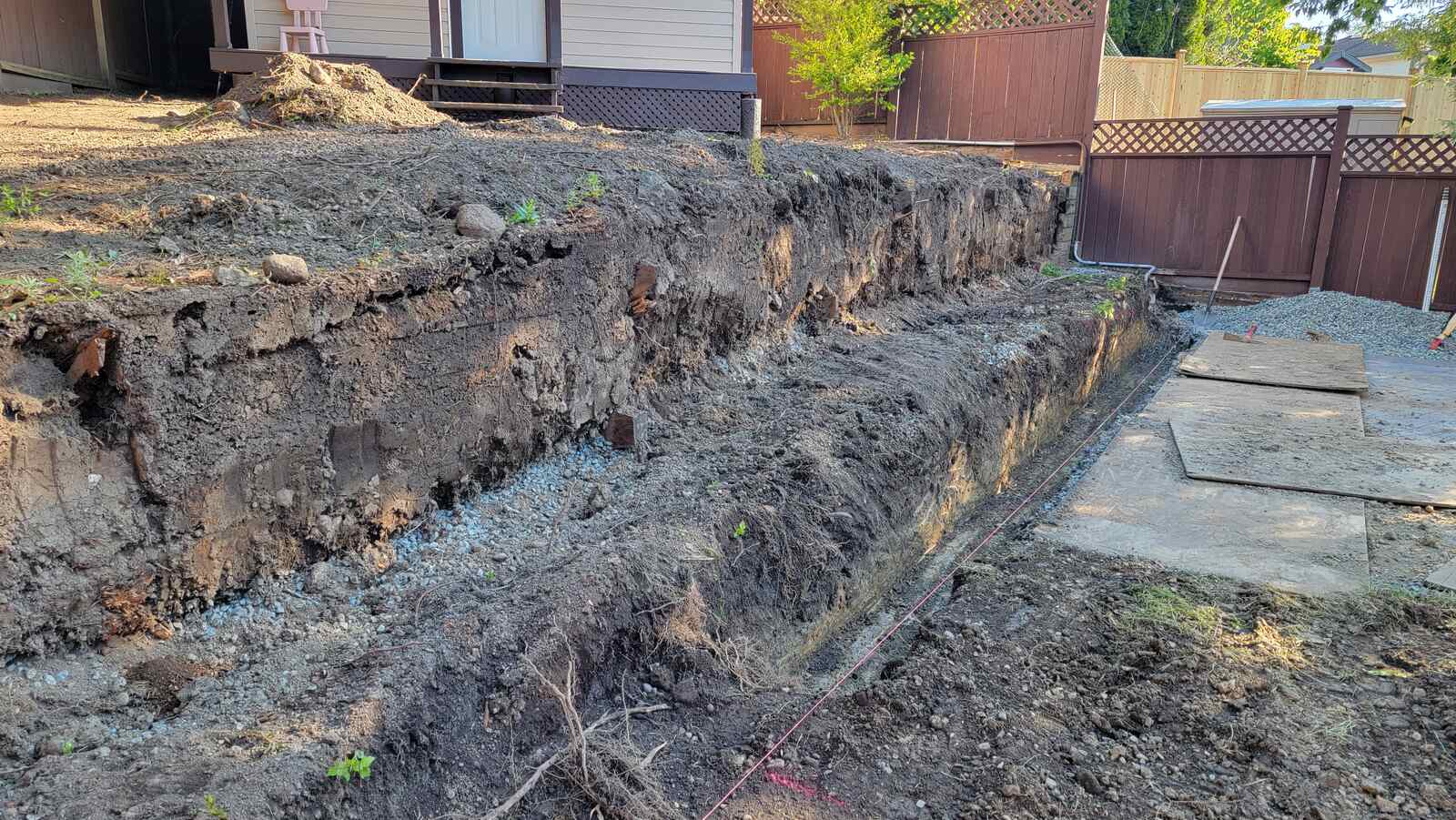 8_wide-view-of-yard-with-earthworks-and-partial-retaining-wall-back40-landscaping-langley-bc