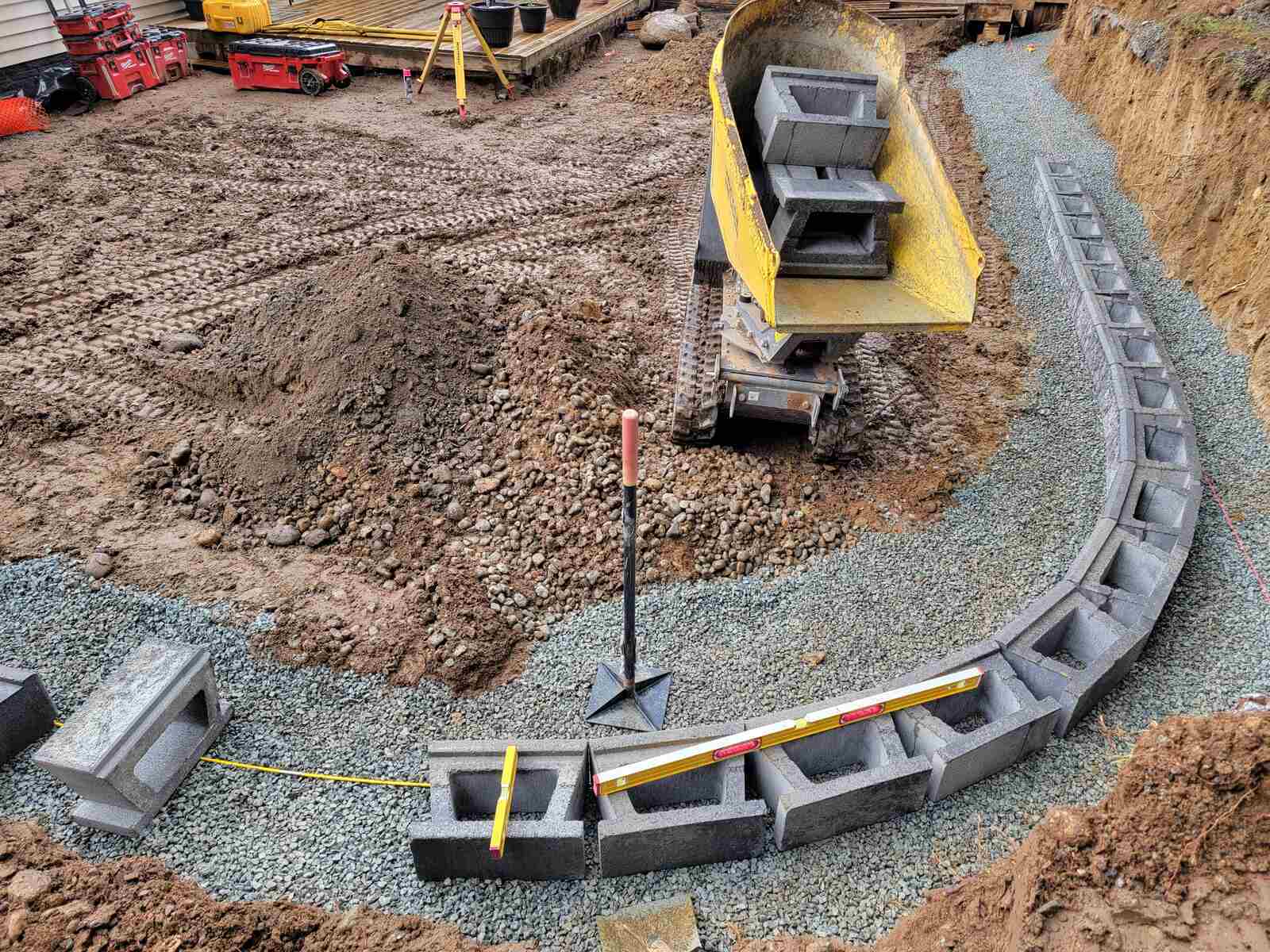 11_Early-stage construction of a retaining wall with concrete blocks by Back40 Landscaping in Mission, BC