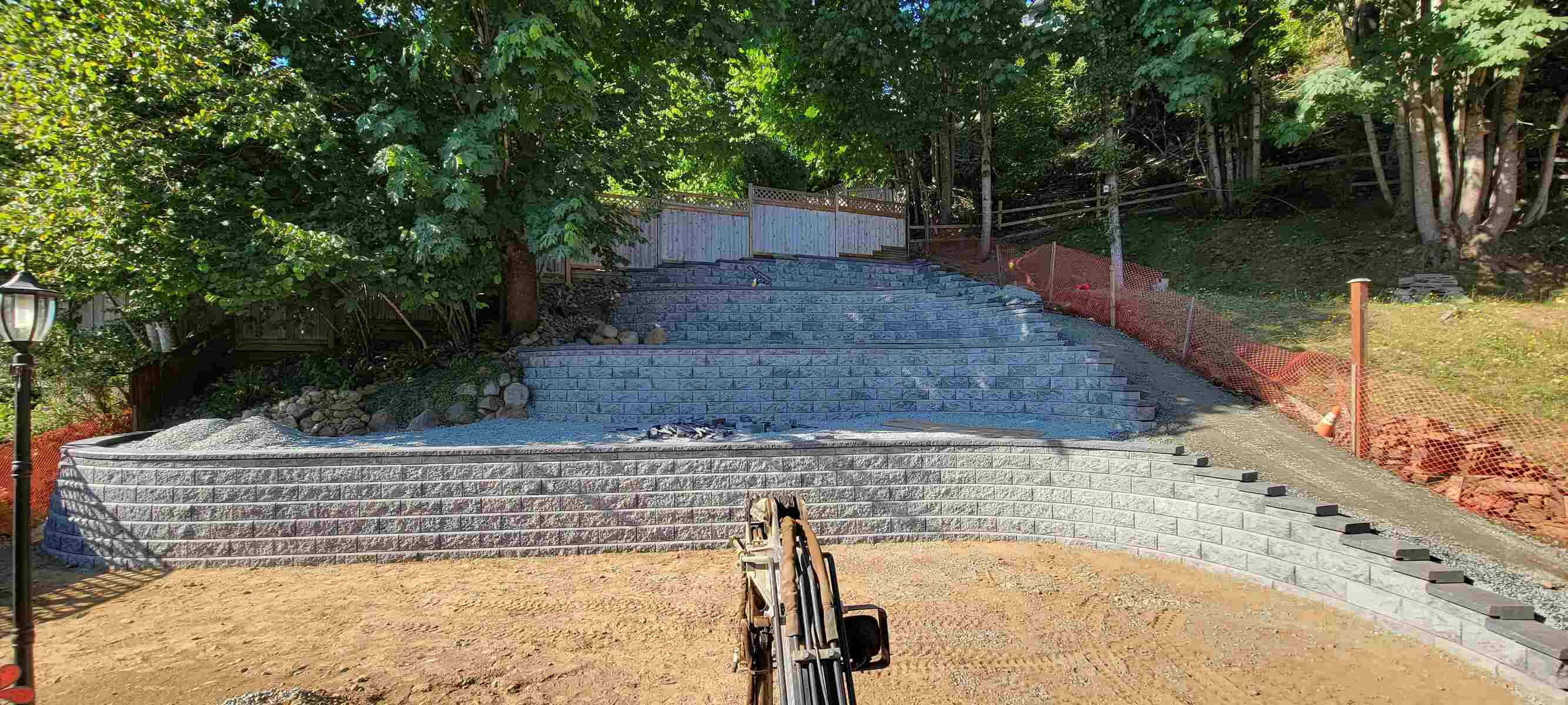 22_Four-tiered retaining wall under construction by Back40 Landscaping in Mission, BC