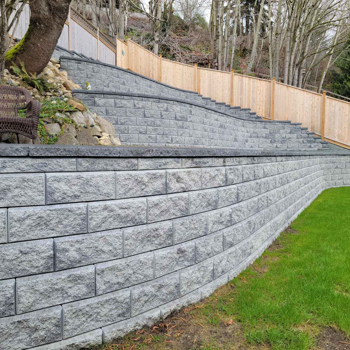 26_Detailed view of a retaining wall section with decorative landscaping in Mission, BC, by Back40 Landscaping