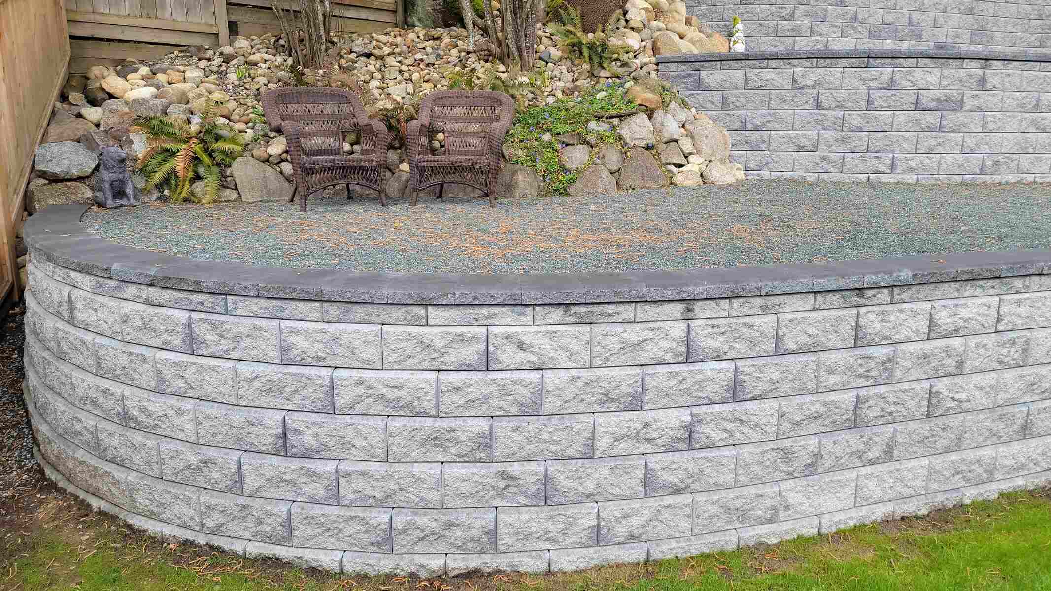 27_Backyard retaining wall project surrounded by greenery in Mission, BC, by Back40 Landscaping