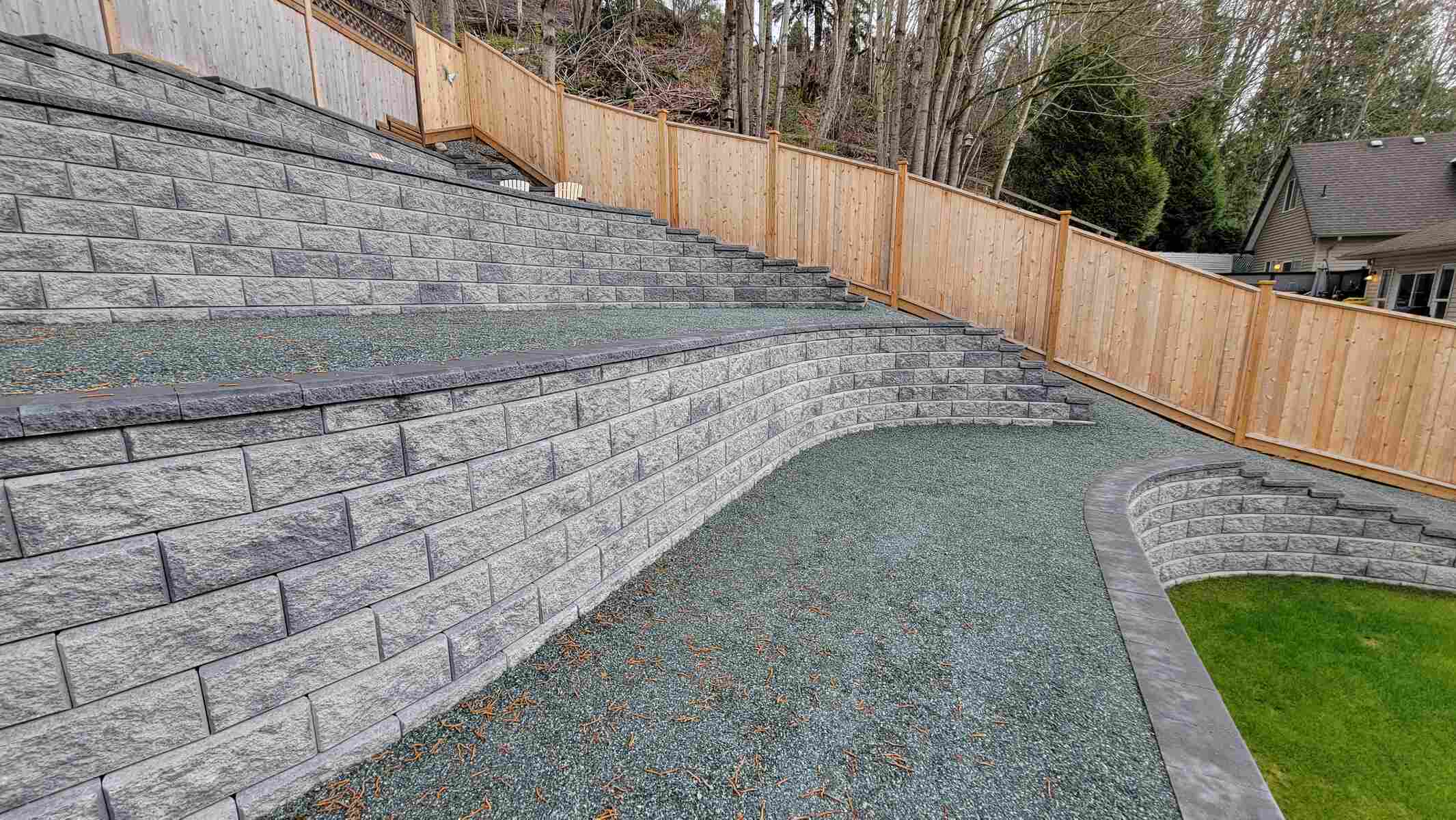 29_Four-tier retaining wall with curved design elements by Back40 Landscaping in Mission, BC