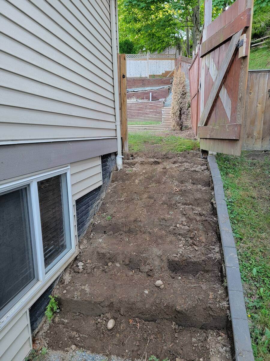 3_Side yard excavation for four-tiered retaining wall project by Back40 Landscaping in Mission, BC