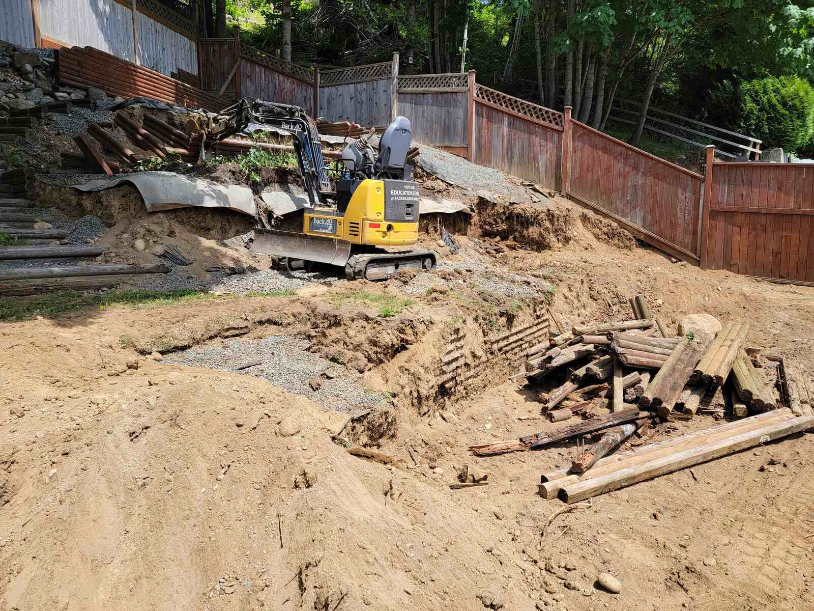 6_Mission, BC backyard excavation for a four-tiered retaining wall project by Back40 Landscaping