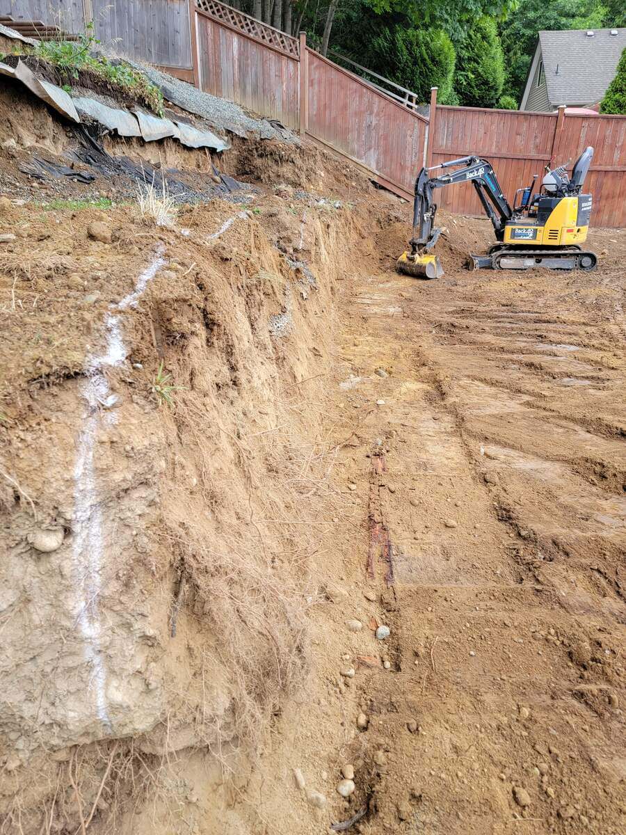 7_Excavated slope prepared for retaining wall installation by Back40 Landscaping in Mission, BC