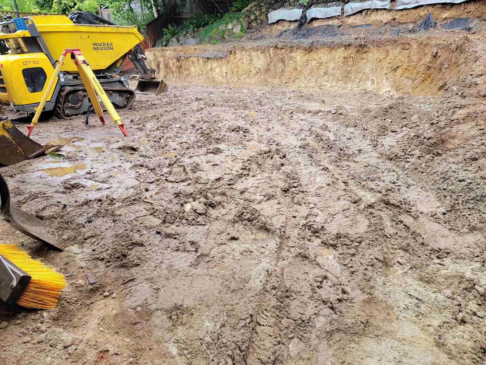 8_Excavated site with compacted dirt for four-tiered retaining wall construction by Back40 Landscaping in Mission, BC