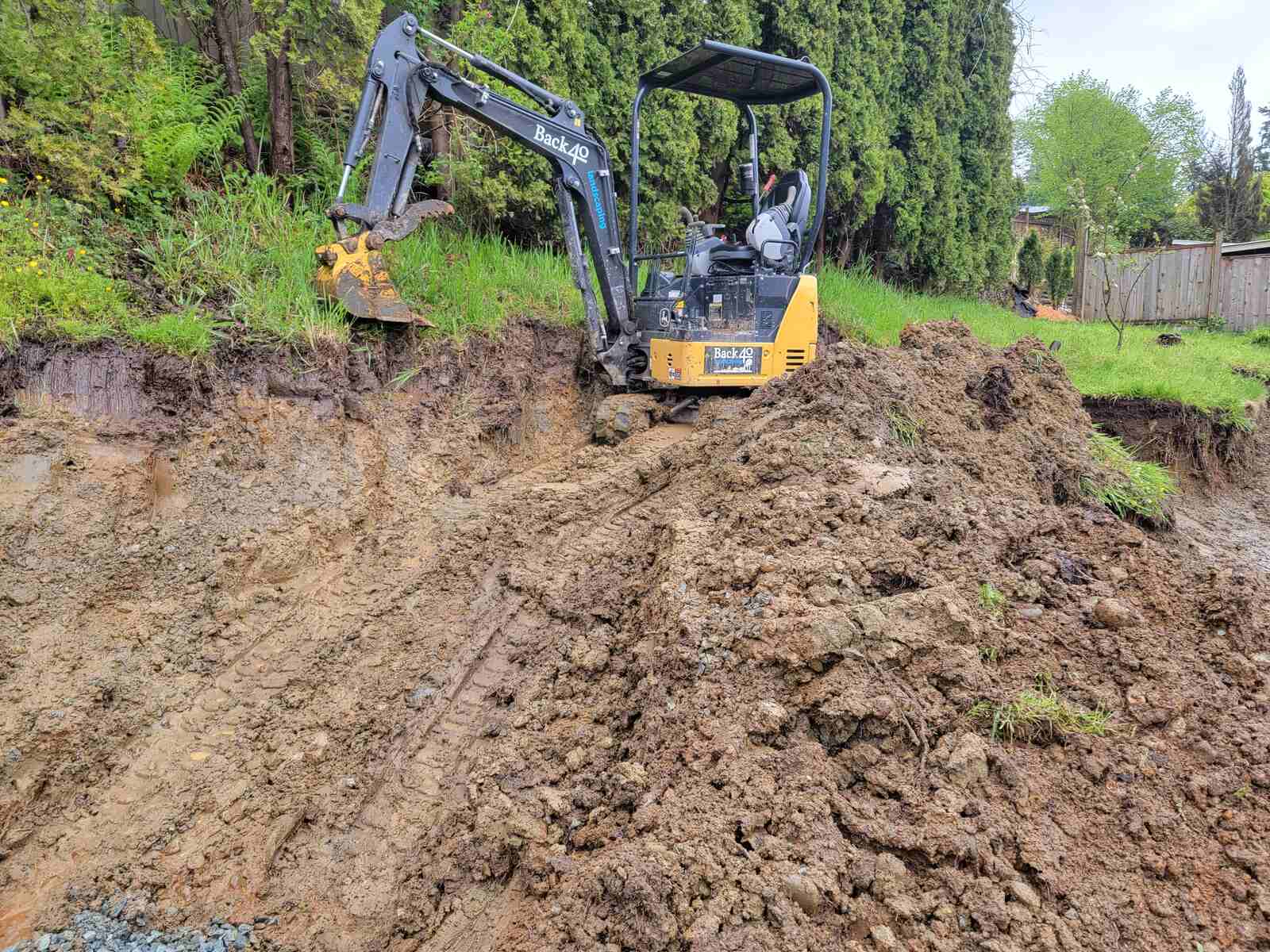 3_Excavator digging soil for a landscaping project by Back40 Landscaping in Mission, BC