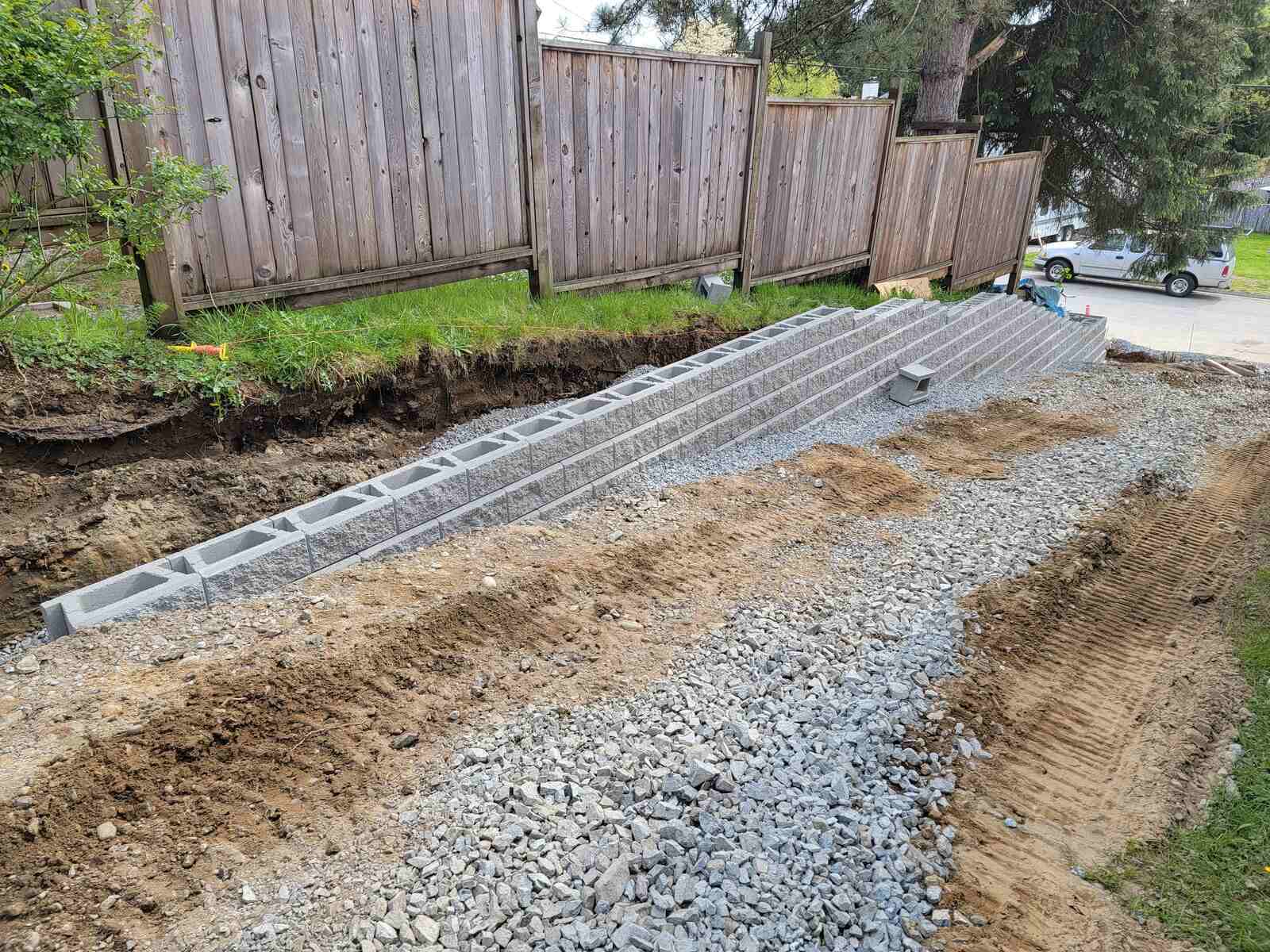 5_Retaining wall blocks laid alongside gravel driveway by Back40 Landscaping in Mission, BC