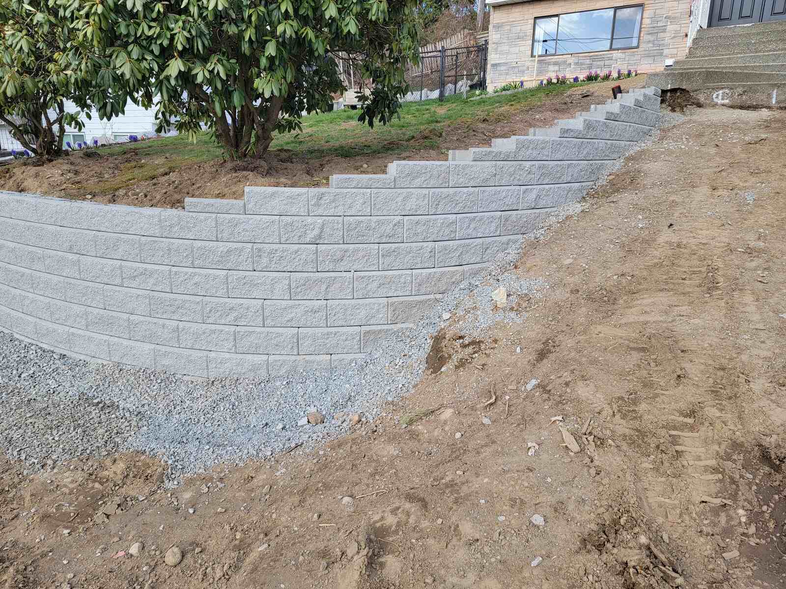 12_retaining wall with a slope and landscaping in Mission, BC, by Back40 Landscaping