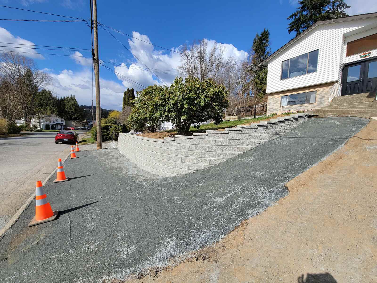 16_Finished driveway landscaping with retaining wall and slope in Mission, BC, by Back40 Landscaping