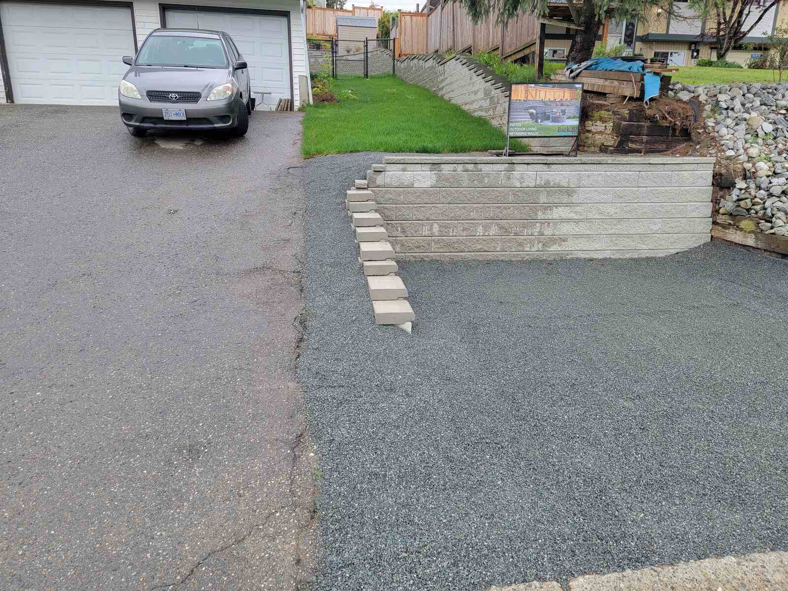 17_Driveway retaining wall with landscaping and a residential backdrop in Mission, BC, by Back40 Landscaping