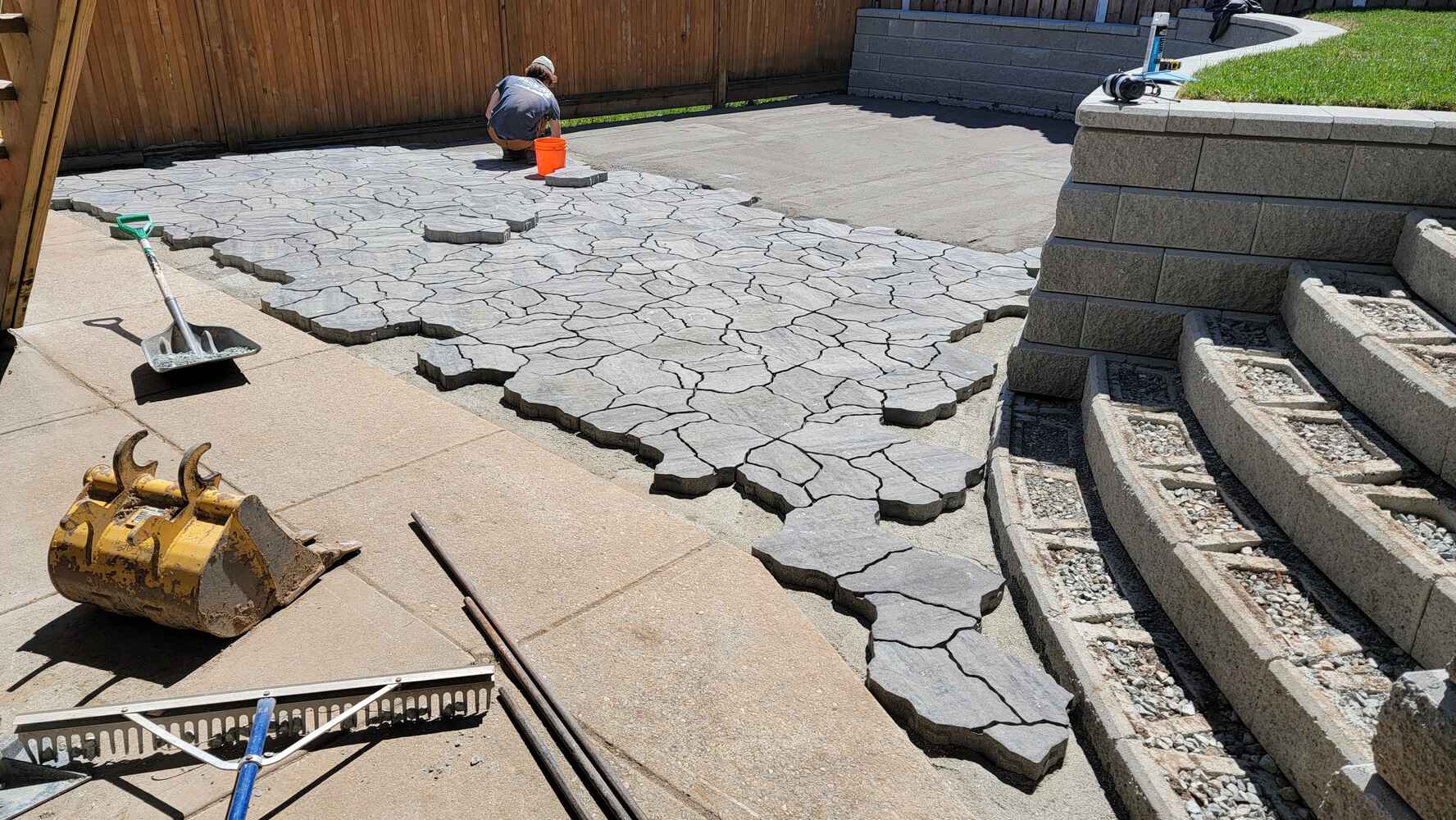 19_flagstone patio with curved design and retaining wall by Back40 Landscaping in Mission, BC