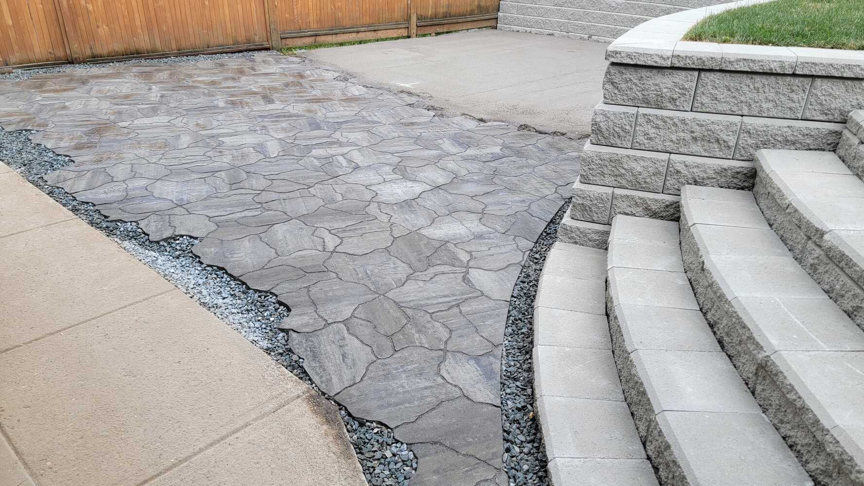 20_flagstone patio alongside a tiered retaining wall by Back40 Landscaping in Mission, BC