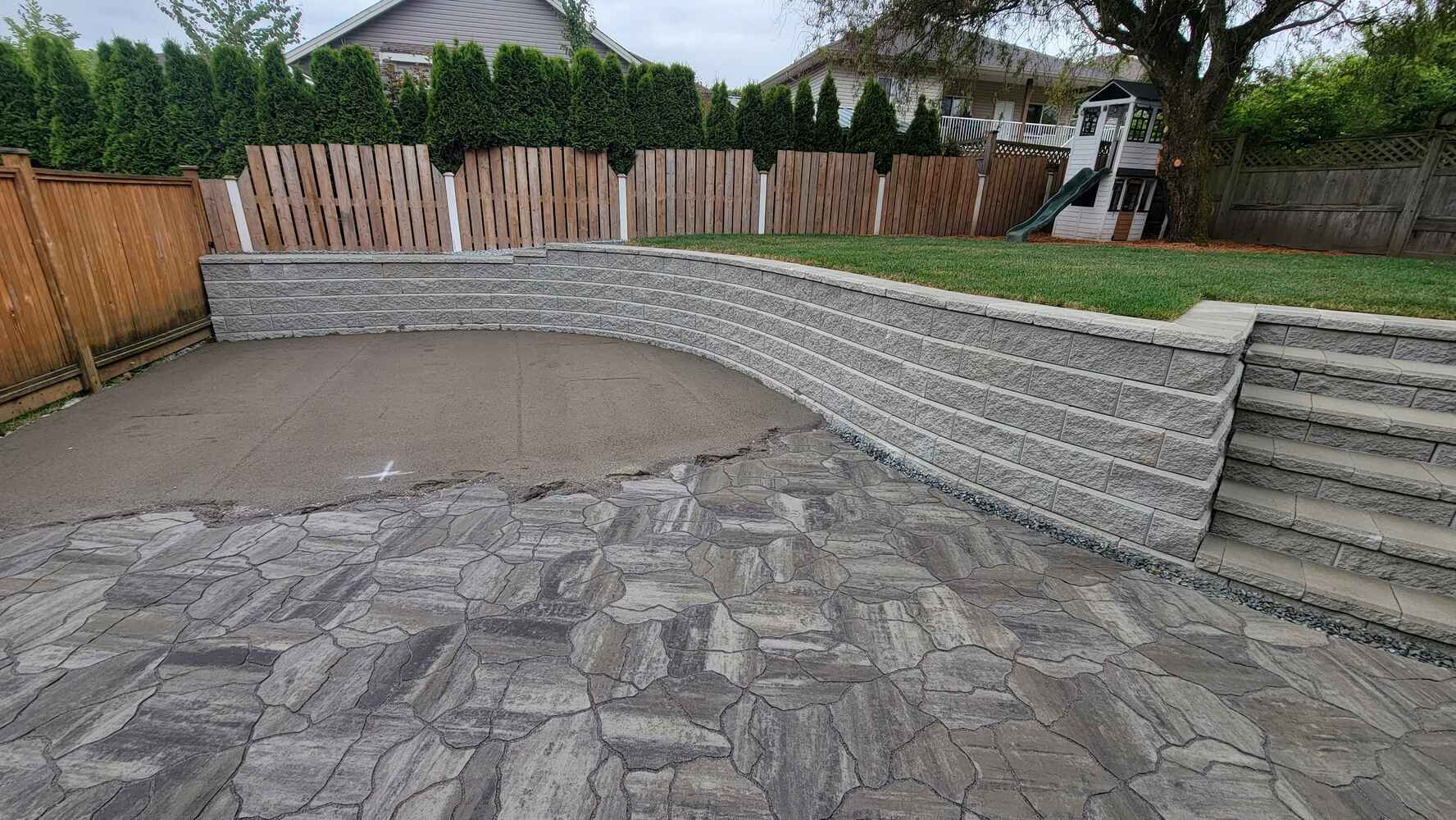 25_Patio and retaining wall with steps for backyard landscaping by Back40 Landscaping in Mission, BC 25_Patio and retaining wall with steps for backyard landscaping by Back40 Landscaping in Mission, BC