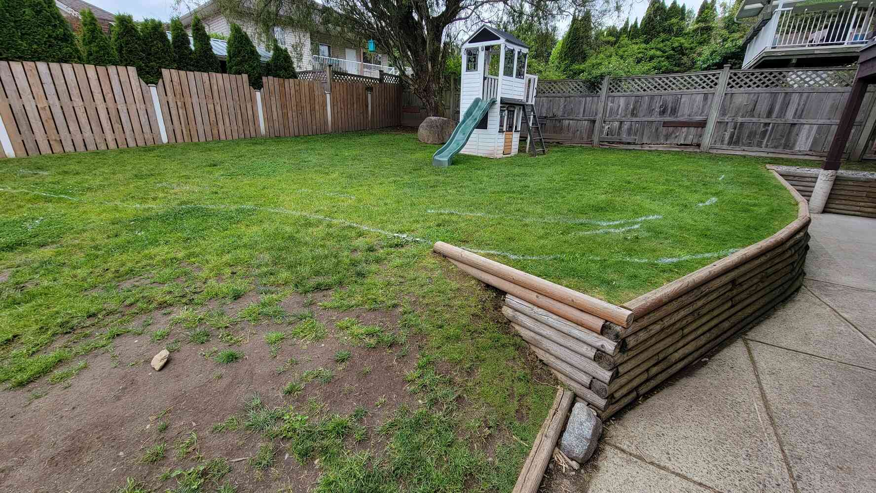 2_View of a backyard with initial excavation for a retaining wall project by Back40 Landscaping in Mission, BC
