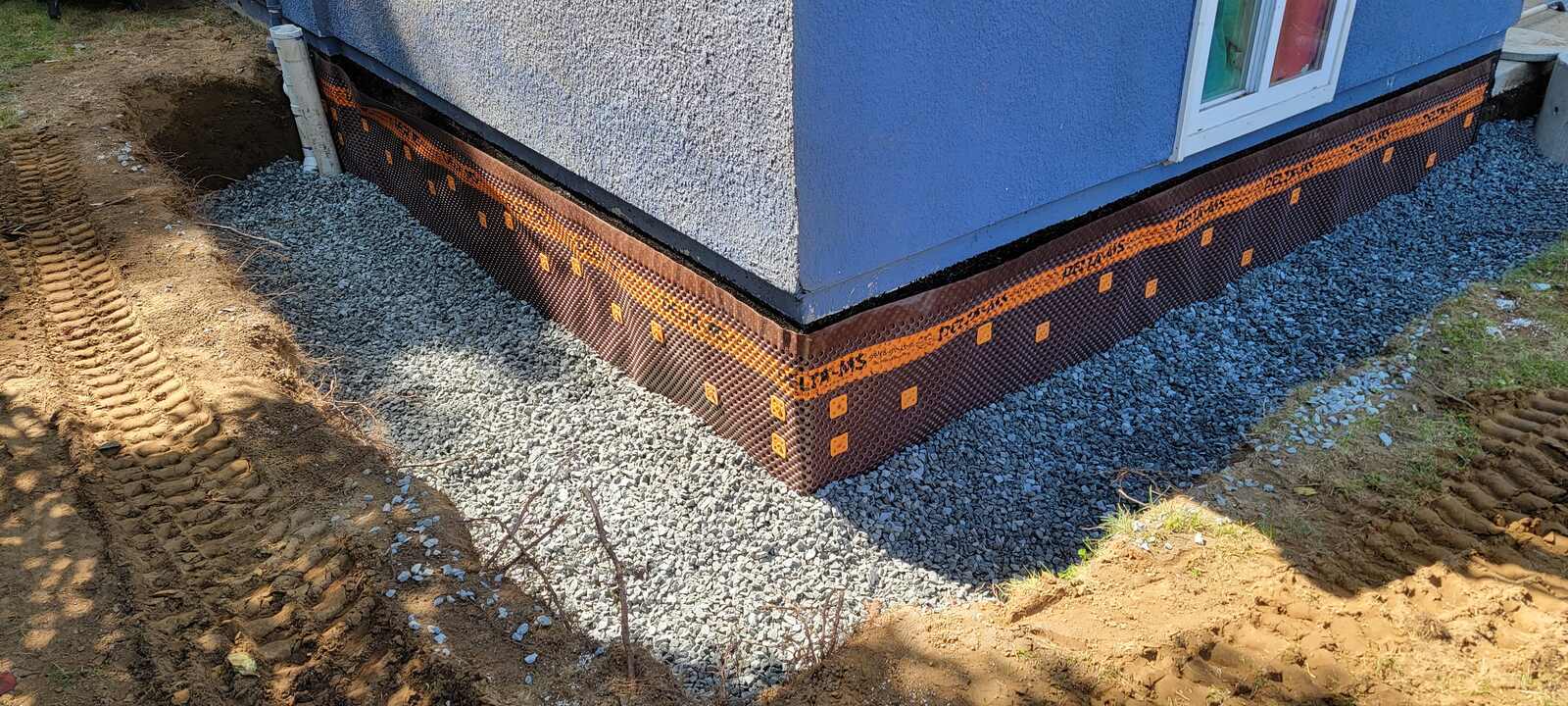 Foundation waterproofing with gravel fill and protective barrier by Back 40 Landscaping in Abbotsford, BC Foundation waterproofing with gravel fill and protective barrier by Back 40 Landscaping in Abbotsford, BC