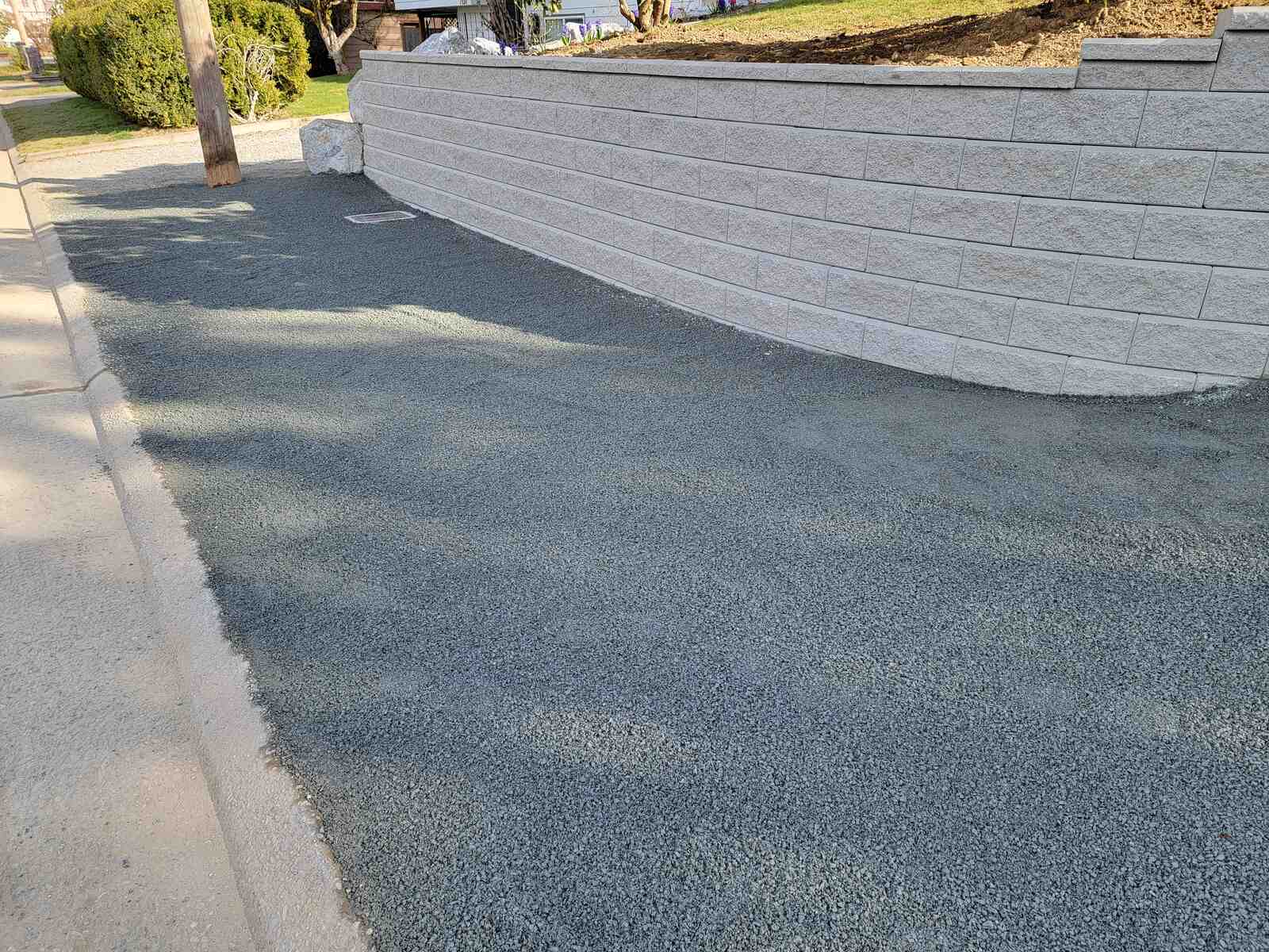 Retaining wall with gravel fill by Back 40 Landscaping in Abbotsford, BC, adding structural support and style