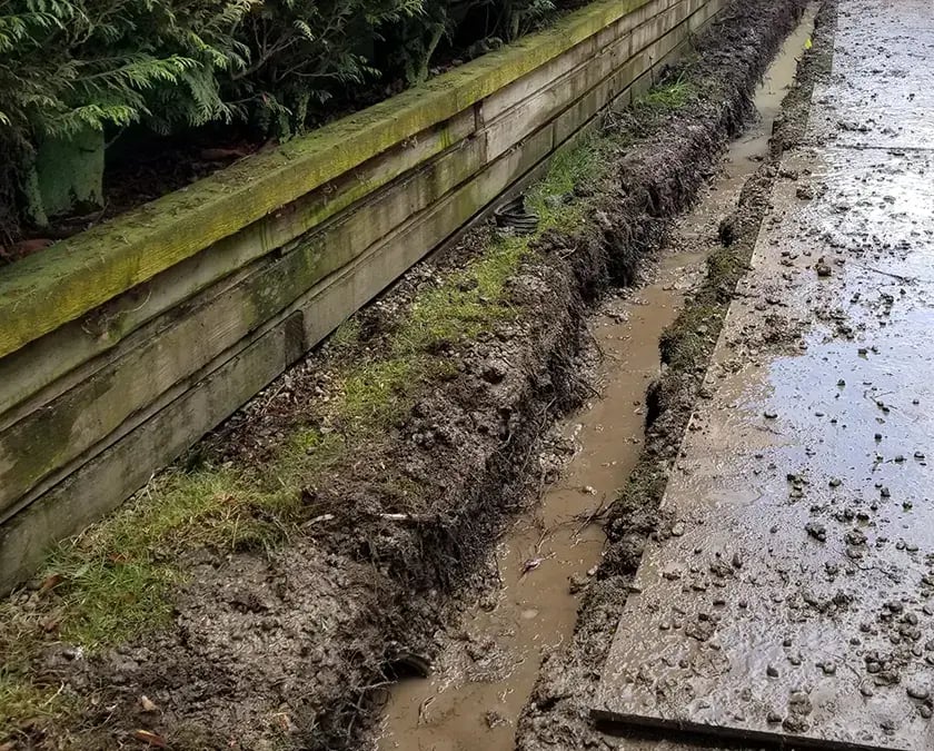 french-drain-trench-filled-with-water