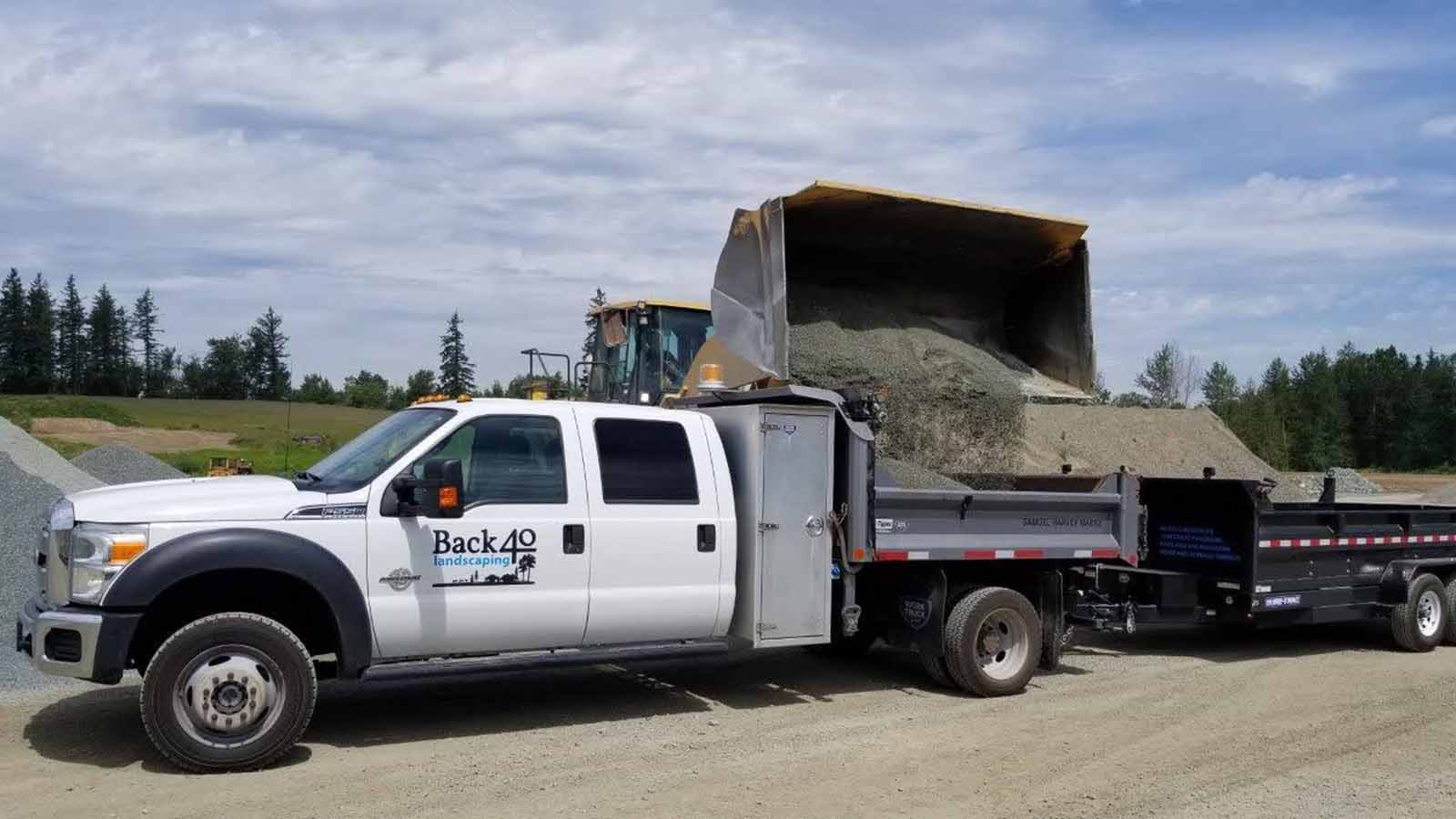 Gravel Being Loaded in Back 40 Truck & Trailer