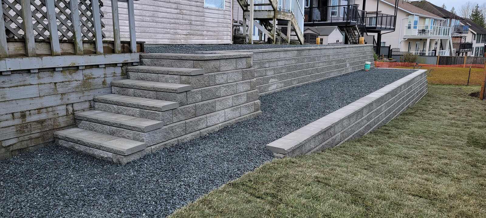 Close-up detail of concrete blocks in newly constructed retaining wall by Back 40 Landscaping, Chilliwack, BC