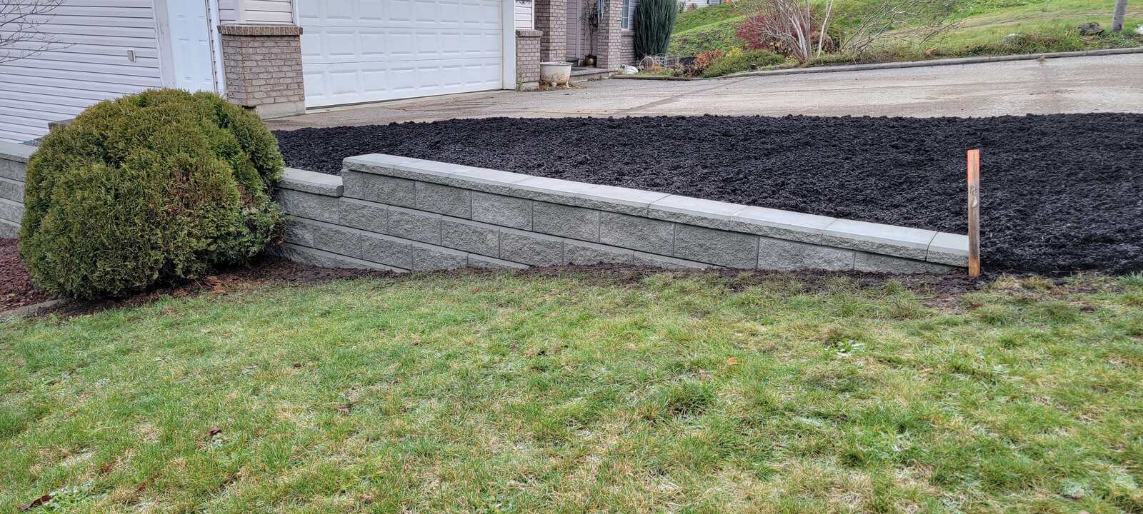 Close-up view of freshly installed retaining wall blocks by Back 40 Landscaping, Chilliwack, BC