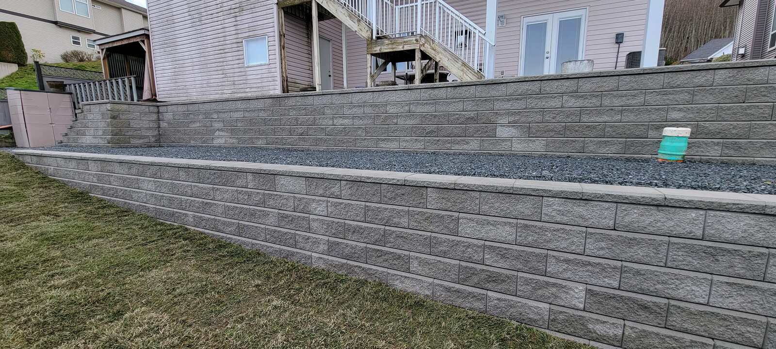 Concrete retaining wall with step design, completed by Back 40 Landscaping, Chilliwack, BC