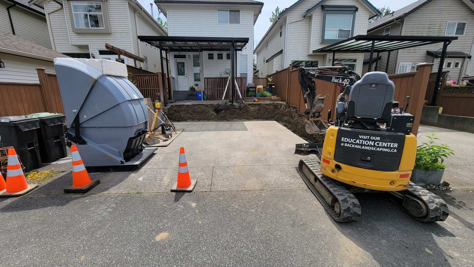 Backyard excavation and debris removal for retaining wall rebuild in Langley, BC by Back 40 Landscaping