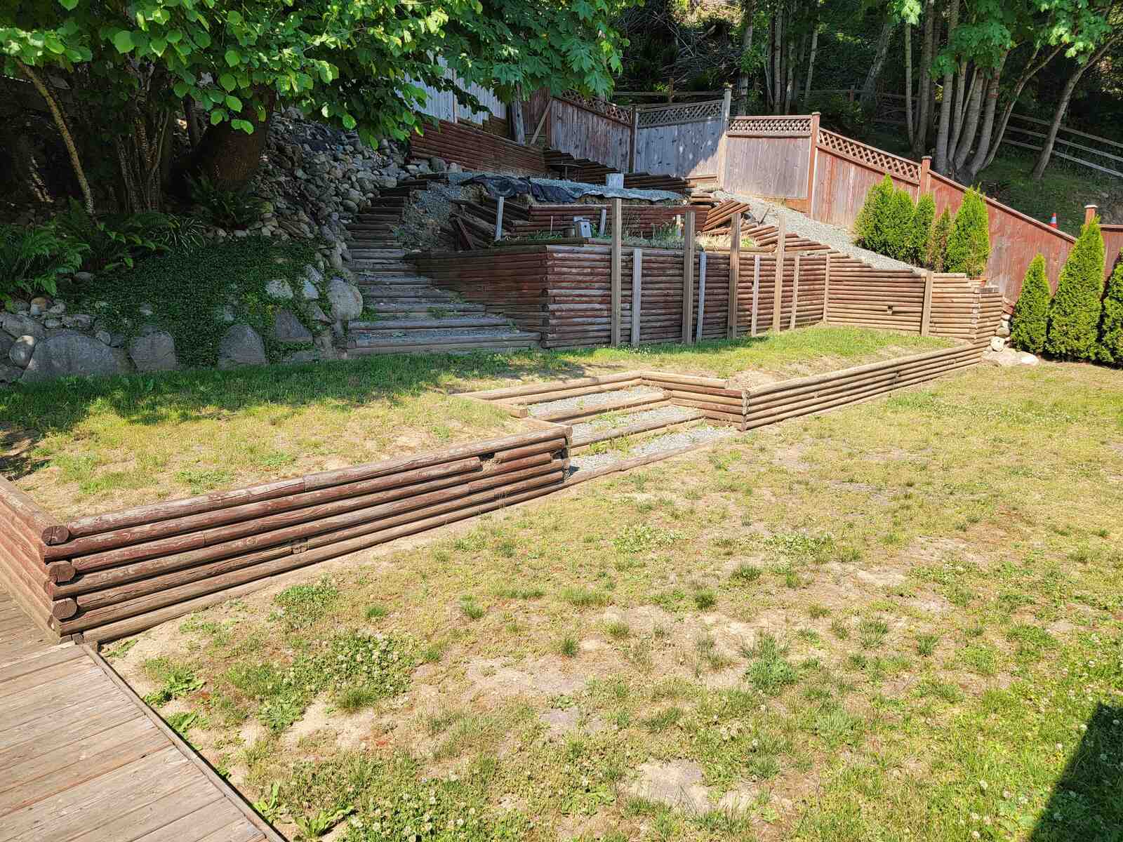 Close-up of a four-tiered retaining wall in Langley, BC, created by Back 40 Landscaping