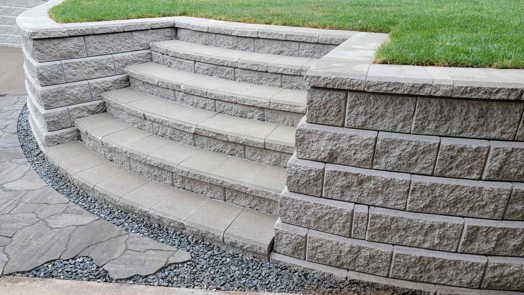 27_Landscape project with flagstone patio and curved retaining wall by Back40 Landscaping in Mission, BC